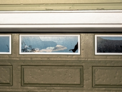 Damaged residential garage door.
