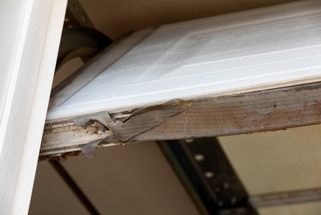 Garage door weatherstripping damaged.
